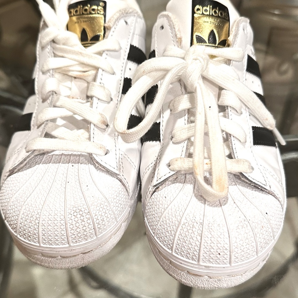 Brand New Adidas Shoe. Size 4. White and Black classic tennis shoe